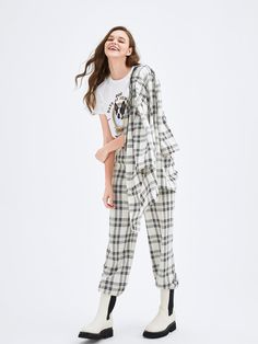 Details: Elastic waistband. Slant pockets on side. Classic straight fit. Tartan-checked print. Pair with Black and White Checkered Blazer. Materials & Care: 70% Polyester, 25.8% Viscose, 4.2% Spandex Hand wash | Gentle dry clean Do not bleach Size & Fit: Model is 5'8", Bust 30, Waist 24, Hips 36, wearing a size S Item #: UK2PA101C Plaid Cotton Bottoms For Work, Plaid Cotton Pants For Work, Cotton Plaid Pants For Workwear, Plaid Cotton Workwear Bottoms, Checkered Trousers, Checkered Blazer, Cropped Sleeves, Silk Suit, Cropped Blazer