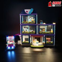 two legos are shown with their lights on and the building is made out of lego blocks