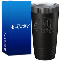 a black tumbler cup next to a blue box and the logo for cupsty