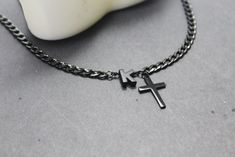 No matter who is President. Jesus is the King. This Personalized black cross necklace is a wonderful gift for Confirmation ,this  Personalized Cross Necklace is best  Confirmation Sponsor Gift, godparent gifts ,christening gifts  Chain and clasp : Very High quality waterproof stainless chain.thick chain and All findings Dimension: 4.8 x 6.5 mm. Snake black chain is 2 mm **Adorable cross pendants , 20 x14 mm,black letter 8 mm ,silver letter 7mm HELP WITH Necklace SIZING: The best way to determine the proper length to order is to drape a string around your neck, and to cut it once you have determined the length that suits you. Use that measurement as a guide to ordering the closest length available in the style of your choice. This initial black cross necklaces created and hand crafted with Confirmation Sponsor Gifts, Black Cross Necklace, Snake Black, Personalized Cross Necklace, Gifts Christian, Godparent Gifts, Letter Jewelry, Godmother Gifts, Black Cross