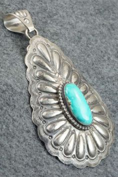 This vintage Royston turquoise and sterling silver pendant was made by Navajo silversmith Raymond Delgarito. The back is signed RD and stamped sterling.Please note this is a pre-owned piece, with patina, in vintage condition.Length: 3 5/8"Width: 2"Free shipping on all orders! We ship with USPS and always include tracking. All orders ship within a day of payment.Returns are accepted up to 30 days after you receive your order. Just send us a message. Our shop offers cash back or store credit. The Vintage Turquoise Necklace With Patina, Vintage Blue Turquoise Necklace With Concho, Sterling Silver Turquoise Necklace With Patina, Vintage Sterling Silver Turquoise Necklace With Patina, Southwestern Silver Turquoise Necklace With Patina, Antique Stamped Turquoise Jewelry, Vintage Silver Turquoise Necklace With Patina, Collectible Sterling Silver Turquoise Necklace With Patina, Vintage Sterling Silver Turquoise Necklace