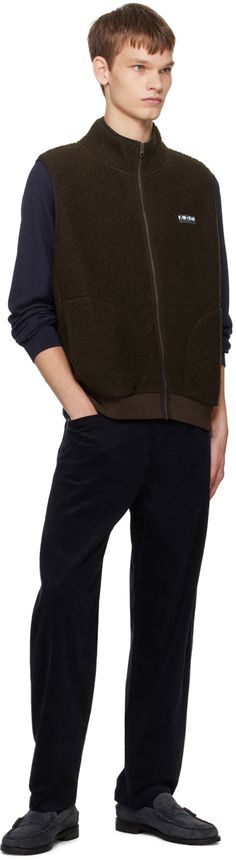 Polyester-blend sherpa fleece vest. · Stand collar · Zip closure · Logo patch at chest · Welt pockets · Rib knit hem · Unlined Supplier color: Brown Rory Sweater, Fly Logo, Corduroy Jeans, Silver Engraving, Fleece Vest, Knit Crewneck, Wool Blend Sweater, Sherpa Fleece, Logo Graphic