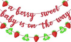 a red banner with strawberries hanging from it's sides and the words berry street baby is on the way