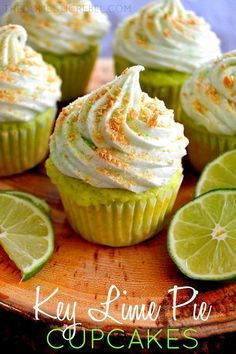 lime cupcakes with white frosting and orange sprinkles on top