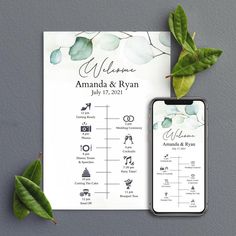 an iphone next to a wedding program on top of a sheet of paper with leaves