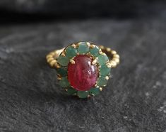 Gold Ruby Ring set with Natural Ruby in a smooth cut & natural red color, at 10x8mm, 3 Carats, sourced from Burma. Surrounded with Natural Emeralds in a diamond cut at 3mm, from Colombia. Victorian Ring design made of Solid 925 Sterling Silver ☞ made to last.**The ring is plated with 18k Gold (the thickest plating - 3 Micron) over Solid 925 Sterling Silver.Matching Pendant & Earrings - please ask meJuly & May Birthstone - Genuine & Natural Stones ❀☞ Choose your size ☞ I resize (b 18k Diamond Ring, Silver Vintage Ring, Ruby Emerald Ring, Ruby And Emerald Ring, Rubi Ring, Real Ruby Rings, Ruby Ring Designs, Natural Stone Rings, Antique Ruby Ring