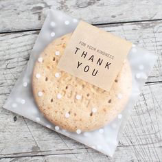 a thank you card on top of a cookie