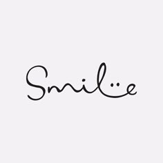 the word smile written in cursive writing on a white background with black ink