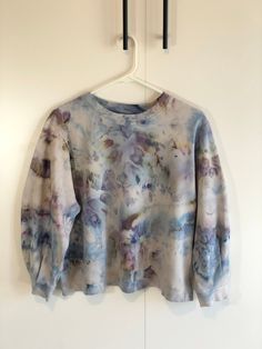 This bishop sleeve blouse is hand dyed by an artisan. Each item will be unique due to the unpredictable nature of tie dye. A touch of thoughtful detail elevates the simple design of the Bishop Long-Sleeve Blouse for a wardrobe essential. Long sleeves pair with a crew neckline for sophisticated coverage, matched by the polished style of subtle hues. Small pleats adorn the sleeves for feminine detail, accentuated by wrist cuffs for refined flair. The piece is complete with 100% cotton for breathab Bishop Sleeve Blouse, Hand Dyed Silk Ribbon, Polished Style, Ice Dyeing, Hand Dyed Silk, Tie Dye Sweatshirt, Bishop Sleeve, Womens Crewneck, T Shirt Photo