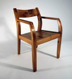 a wooden chair sitting on top of a white floor