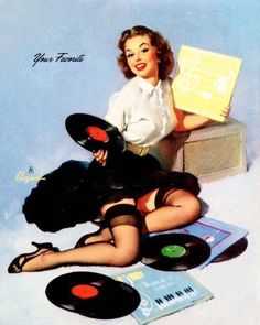 a woman laying on the ground next to record players