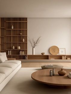 a living room filled with furniture and a wooden table in front of a large window