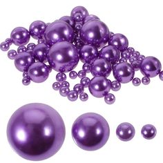 purple pearls are scattered on top of each other, including one large and two small balls