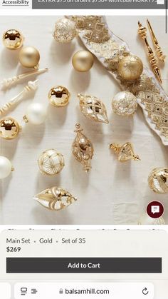 an assortment of gold and white ornaments are on the table with price tags for each item