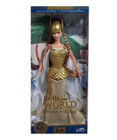 the doll is wearing a gold dress and braid