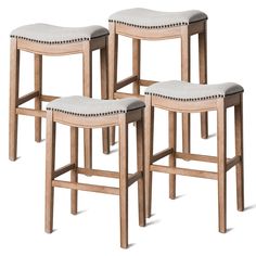 three wooden stools with upholstered seat cushions