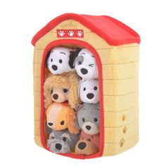 a group of stuffed animals in a toy house