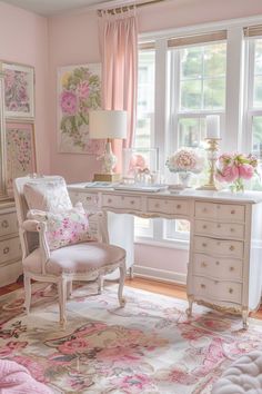 a bedroom with pink walls and white furniture