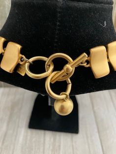 "Beautiful Vintage ANNE KLEIN Matte Gold Modern Classic Statement Collar Necklace Circa 1990's Very good condition...two tiny marks...see photos...barely noticeable Signed Anne Klein Very nice quality and weight Matte gold finish Modern and classic Couture look Statement making necklace Adjustable toggle closure 18\" overall length, 1\" wide" Vintage Gold-tone Jewelry With Toggle Clasp, Retro Adjustable Gold Necklace, Adjustable Retro Gold Necklace, Vintage Gold Metal Toggle Necklace, Vintage Metal Toggle Necklace As Gift, Vintage Metal Toggle Necklace For Gift, Vintage Gold Toggle Chain Necklace, Vintage Necklace With Toggle Clasp, Vintage Gold Toggle Necklace