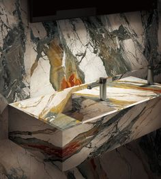 a marble sink in the middle of a room