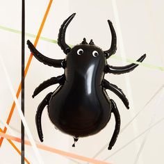 an inflatable spider balloon with eyes on it's back