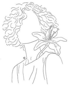 a line drawing of a woman with a flower in her hair, looking off to the side