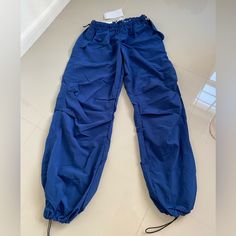 Nwt Bershka Parachute Navy Blue Pants Size Small New! With Its Original Tag. No Flaws Bought In Italy Blue Stretch Straight Leg Cargo Pants, Blue Stretch Pants With Cargo Pockets, Stretch Blue Pants With Cargo Pockets, Casual Blue Pants With Drawstring, Blue Stretch Cargo Pants For Spring, Summer Blue Cargo Pants For Streetwear, Blue Stretch Wide Leg Cargo Pants, Trendy Blue Baggy Parachute Pants, Trendy Baggy Blue Parachute Pants