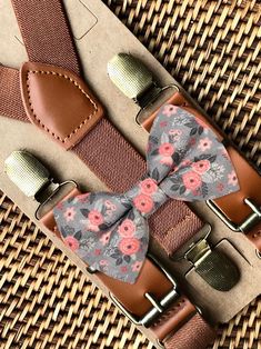 "This floral bow tie & suspender set is a great choice for ring bearer gift, ring bearer outfit, bowtie, floral bow tie, boho wedding, bow tie, wedding, or any other special occasion. ❤ **Please Specify**  Bow Tie Only (w/ Clip or Neck Strap), Suspenders Only, or Bow Tie Only & Susp (Bow Tie and Suspenders) SUSPENDERS- One Pair of our Quality Suspenders BOW TIE - One Bow Tie on White Adjustable STRAP or Alligator CLIP PET BOWTIE w/ Elastic Loops- Slips on a Dog/Cat/Pet Collar **CLIP ON Bow Ties are Recommended/Suitable for Children Only X-Small: 6 months- 2 years Small: 3 years- 5 years Medium: 6 years- 10 years Large: 10 years- Up To 6ft tall Adult: Adults Over 6ft Tall RUSH MY ORDER- Need you order ASAP? Simply add this to your cart before checkout: https://www.etsy.com/listing/219295405 Elegant Adjustable Belts And Suspenders For Wedding, Dapper Suspenders For Wedding, Dapper Wedding Suspenders, Dapper Adjustable Bow Tie For Weddings, Adjustable Bow Tie For Suit As Gift, Adjustable Bow Tie For Gifts, Adjustable Bow Tie Back Belt For Wedding, Adjustable Wedding Belt With Bow Tie Back, Adjustable Belts And Suspenders For Father's Day Gift