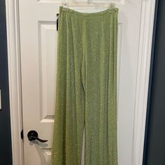 These One-Of-A-Kind Sparkly Green Party Pants Are Flared At The Bottom And High Waisted. Perfect For A Unique Ensemble! You’ll Definitely Stand Out In The Crowd With These. Glamorous Green Bottoms For Party Season, Glamorous Green Evening Pants, Green Bottoms For Night Out Party, Green Bottoms For Night Out, Green Stretch Pants For Party, Green Fitted Pants For Party, Party Fitted Green Pants, Glamorous Fitted Green Pants, Green Fitted Bottoms For Party