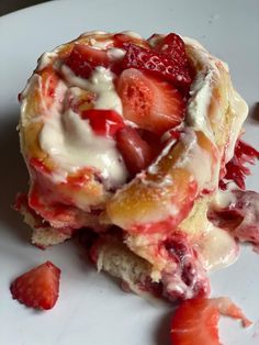 a pastry with strawberries and cream on it