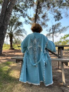 🐘 Blue Elephant Themed Organic Muslin Handmade Bathrobe: A Unique Boho Festival Experience Are you in search of a unique piece of clothing? Here is a special suggestion for you: A handmade organic muslin robe with a blue elephant theme! This robe is specially crafted from 3 layers of muslin fabric and is an example of delicately handcrafted products. 🐘 Unique Design and Customizability This robe is the perfect way to express yourself. Its blue elephant-themed design reflects the concept of boho festival kimono and gives you a unique wearing experience. Also, this robe is customizable, so you can make it fit your own personal style. 🌿 Excellent Water Absorbency and Comfort One of the most striking features of this robe is its excellent water absorbency. The delicate and light muslin fabr Blue Hippie Kimono For Festival, Hippie Style Blue Kimono For Festivals, Blue Kimono For Festival, Blue Bohemian Festival Dress, Blue Long Dress For Festival, Blue Bohemian Long Kimono, Blue Bohemian Robe For Spring, Bohemian Light Blue Kaftan For Beach, Blue Long Bohemian Kimono