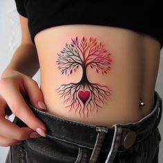 a woman with a tree tattoo on her stomach