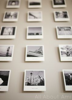 many black and white photographs are arranged on the wall