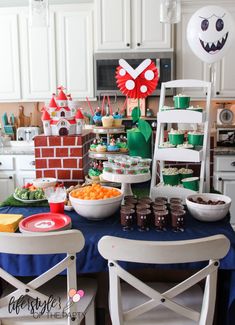 a table filled with lots of food and decorations