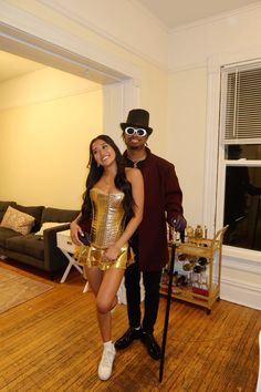 a man and woman dressed up in costumes