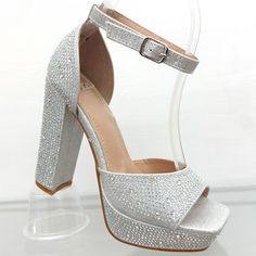 Silver Rhinestones Open Toe Platform Heels -Open Toe -Ankle Strap For Easy Removal -Platform In Front For Greater Comfort. -Silver Rhinestone -Block Heel -Height Heel: 4.5- 5 Inches Aprox -True Size** ** The Sizing Varies By Foot Make Me An Offer Silver Crystal High Heels, Silver Crystal Open Toe Heels, Silver Embellished Crystal Heels, Embellished Silver Crystal Heels, Elegant Silver Crystal Heels, Silver Crystal Heels With Bling, Silver Bedazzled Open Toe Heels, Silver Bedazzled Heels For Party, Silver Bedazzled Crystal Heels