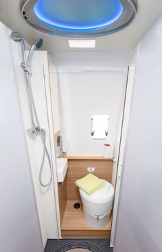 a small bathroom with a toilet and shower