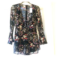 Nwt - Long-Sleeve Floral Romper. Really Cute And Perfect For Fall! Lace Up Front And Wide Sleeves. Bought It From Nordstrom For An Event And Never Got The Chance To Wear It. Fits Sizes 4-6 Best. Floral Print Long Sleeve Jumpsuits And Rompers For Party, V-neck Jumpsuits And Rompers For Fall Brunch, Chic Long Sleeve Jumpsuits And Rompers For Brunch, Black Long Sleeve Jumpsuits And Rompers For Fall, Chic Long Sleeve Jumpsuits For Brunch, Fall Brunch V-neck Jumpsuits And Rompers, Printed Long Sleeve Jumpsuits And Rompers For Fall, Printed Long Sleeve Jumpsuit For Fall, Spring Long Sleeve Jumpsuits And Rompers For Night Out