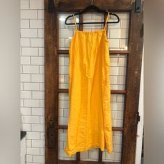 This Beautiful A New Day Dress Is Perfect For Any Occasion. The Dress Features A Square Neckline And Spaghetti Straps, With An Adjustable Tank Top For A Comfortable Fit. The Dress Is Made Of High-Quality Linen Material, Making It Durable And Machine Washable. The Dress Is A Size M And Has A Solid Pattern In A Beautiful Yellow Color. It Has A Pullover Closure And Is Perfect For Travel Or Casual Occasions. The Dress Has Pockets And Comes With A Strap Accent, Making It A Stylish Addition To Any War Mustard Sleeveless Dress For Brunch, Sleeveless Mustard Dress For Brunch, Sleeveless Mustard Dresses For Brunch, Yellow Summer Sundress For Daywear, Summer Yellow Sundress For Daywear, Mustard Sleeveless Sundress For Vacation, Mustard Sleeveless Sundress For Summer, Mustard Sleeveless Casual Sundress, Yellow Cotton Sundress With Spaghetti Straps