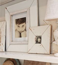 a shelf with pictures and other items on it