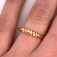 Vintage 1940's 14k yellow gold plain ridge band with Jabel trademark. The band is a size 7. The width of the band is 2.3mm. The height of the ring off the finger is 1.5mm. Heirloom 14k Gold Stackable Rings With Open Band, Classic Adjustable 14k Gold Midi Rings, Classic Double Band Promise Ring, Gold 14k Midi Rings Round Band, 14k Gold Midi Rings With Round Band, Minimalist Yellow Gold Ring With Decorative Band, Classic Adjustable Band Rings, Minimalist Yellow Gold Rings With Decorative Band, Classic Adjustable Thick Band Ring