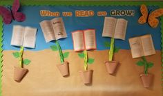 a bulletin board with flowers and books on it that says when we read we grow