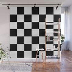 a black and white checkered wallpaper in a living room