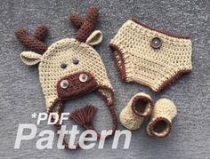 two crocheted deer hats and booties are laying on the ground