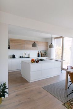 the kitchen is clean and ready to be used for cooking or dining, with plenty of counter space