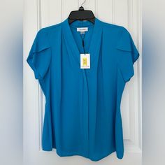 Nwt Calvin Klein Flutter Sleeve Blouse Size Petite Large. Comes From Smoke-Free Pet Friendly Home. Has Been Wrapped In Plastic Since Purchase. Blue Flutter Sleeve Tops For Workwear, Blue Flutter Sleeve Tops For Work, Stretch Blue Office Blouse, Blue Stretch Blouse For Office, Blue Stretch Blouse For Work, Blue Stretch Blouse For Workwear, Chic Blue Blouse With Flutter Sleeves, Fitted Tops With Flutter Sleeves For Workwear, Fitted Flutter Sleeve Tops For Work