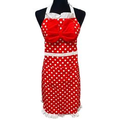 a red and white polka dot apron on a mannequin