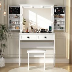 a white dressing table with mirror, stool and lights on the wall above it in an empty room