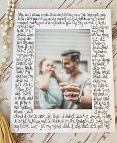 a photo frame with writing on it next to a tassel