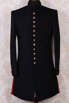 a black jacket with gold buttons on the lapel and red piping down the side